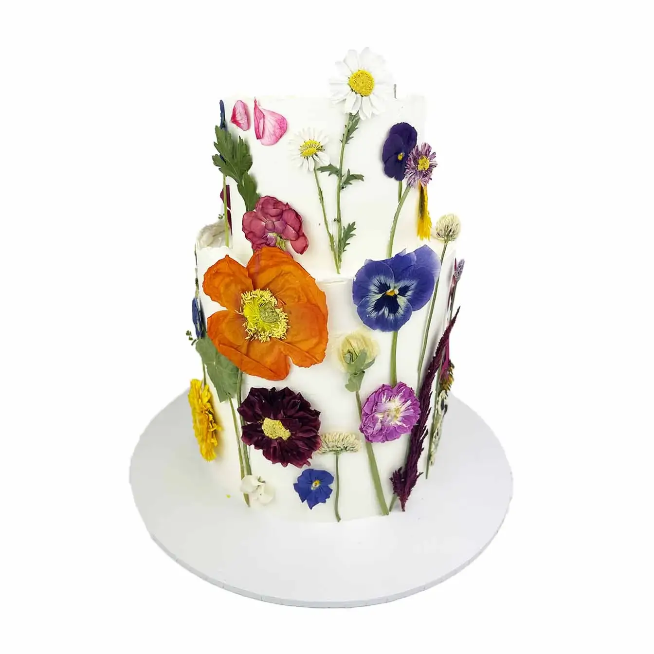Rustic Elegance Floral Cake - A two-tier cake with a rough edge design adorned with delicate freeze-dried pressed flowers, a captivating centerpiece celebrating the charm of nature and rustic elegance.